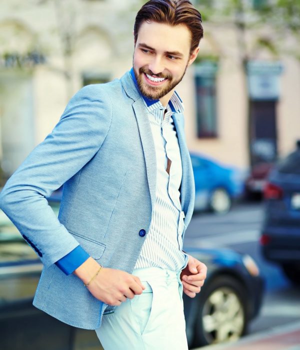 Young stylish confident happy handsome businessman model in suit cloth lifestyle in the street